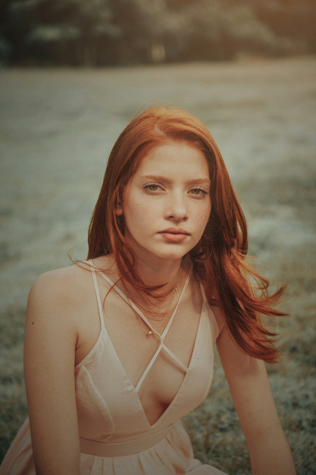 Studio portrait of a Danish woman with short red hair